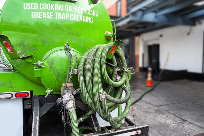 a vacuum truck pumping out a large underground grease trap in Dry Creek